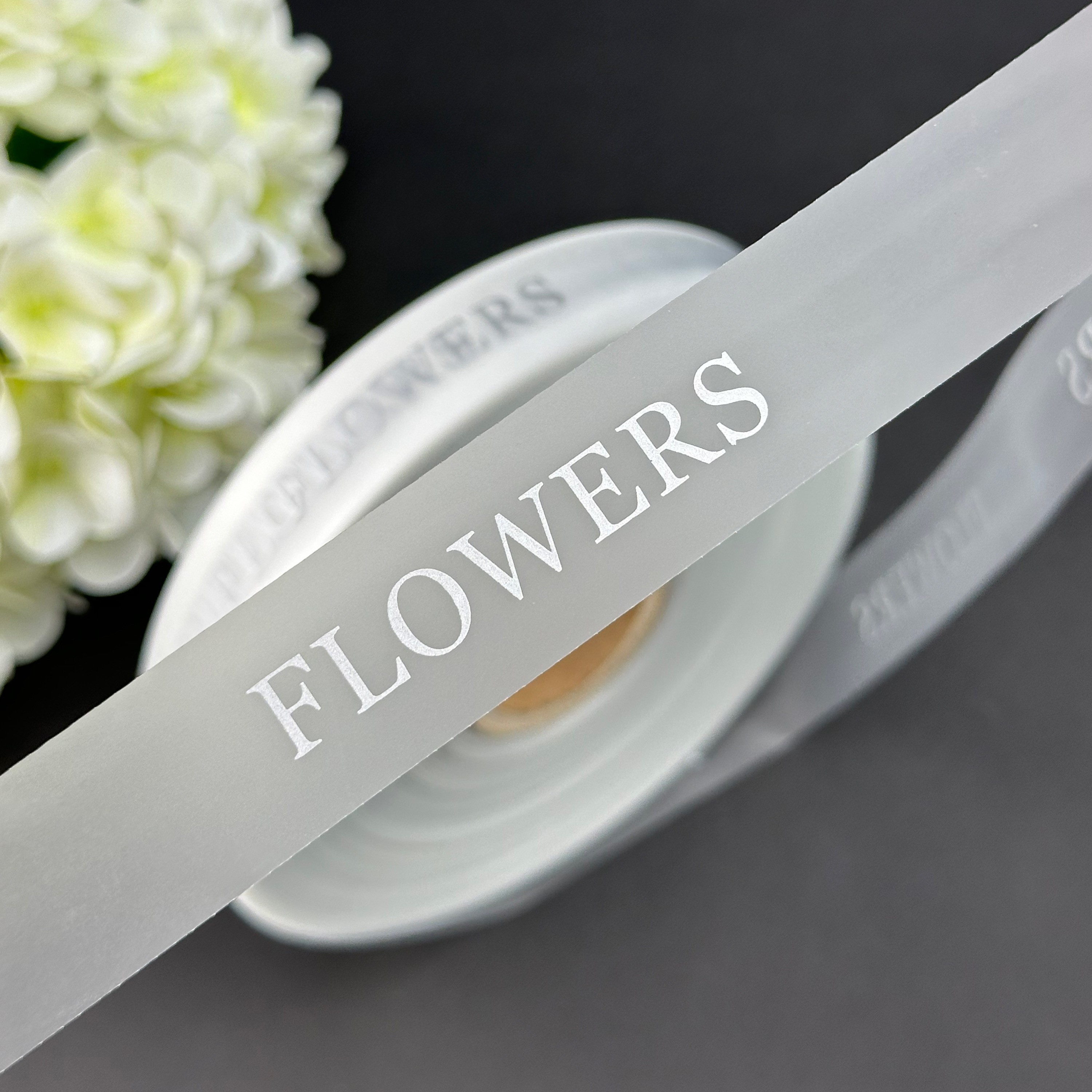 Silicone tape with silver inscription Flowers 2.5 cm by 137.16 m