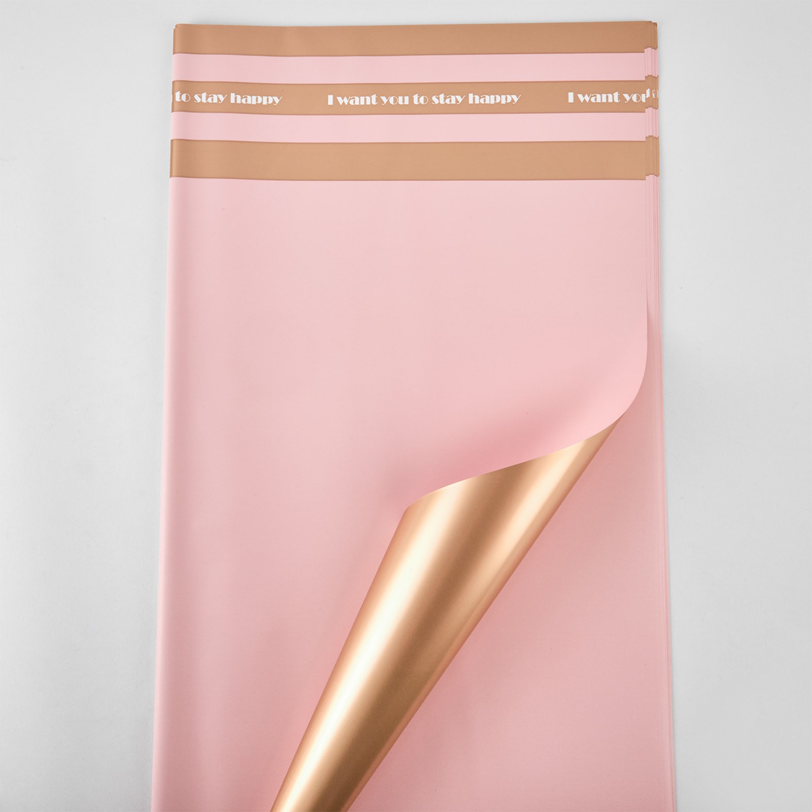 Celofan bicolor cu dungi "Stay happy" aur-roz